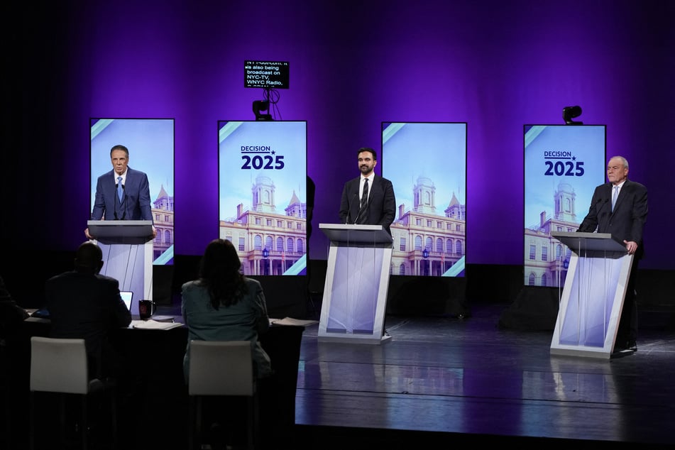 From l. to. r.: Independent Andrew Cuomo, Democrat Zohran Mamdani, and Republican Curtis Sliwa take the stage for the second New York City mayoral debate at LaGuardia Performing Arts Center on October 22, 2025.