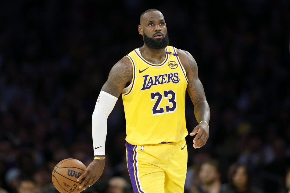 LeBron James of the Los Angeles Lakers tosses the ball back during Game Five of the Western Conference First Round NBA Playoffs at Crypto.com Arena on April 30, 2025.