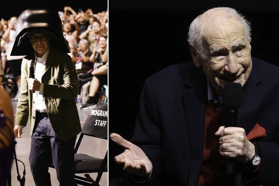 Rick Moranis (l.) wears his Lord Dark Helmet costume as he attends Spaceballs: The New One panel, for which Mel Brooks (r.) contributed a video message, during Comic-Con International in San Diego on July 24, 2026.