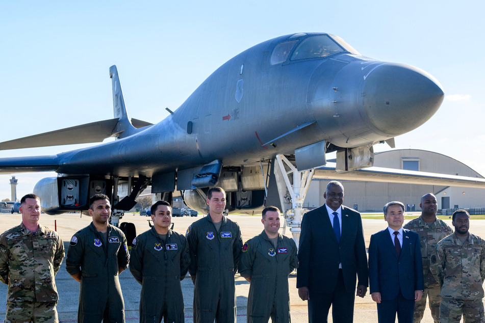 US Secretary of Defense Lloyd Austin (fourth from r.) and South Korea's Minister of National Defense Lee Jong-sup (third from r.) pose during a visit at Joint Base Andrews in Maryland on Thursday. The meeting between the leaders comes following North Korea's launch of three short-range ballistic missiles into the oceans off its east coast.