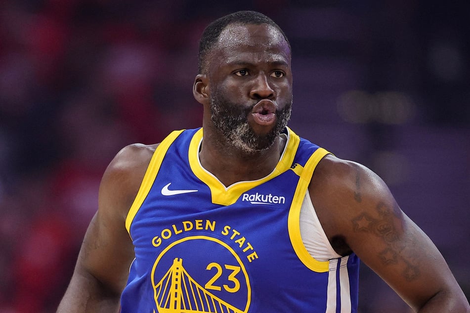 The Minnesota Timberwolves have launched an investigation after a fan was accused of making racially charged comments at Golden State Warriors star Draymond Green.