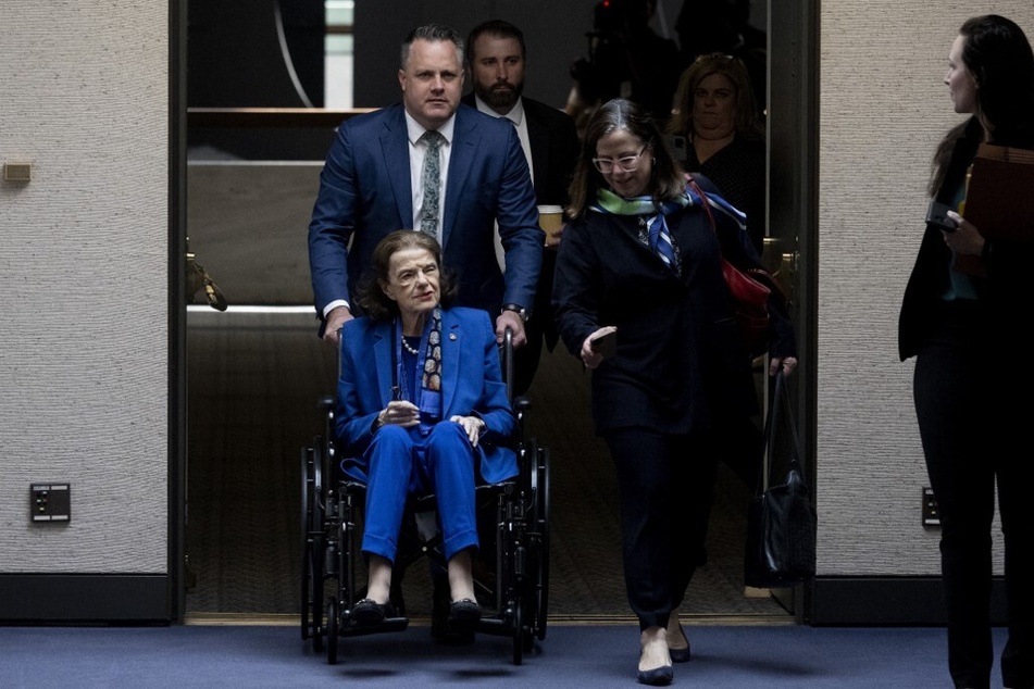 Dianne Feinstein is pushed in a wheelchair as she arrives for a Senate Judiciary Committee meeting on May 11, 2023.