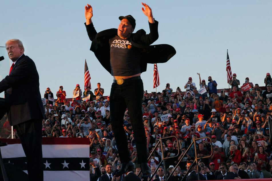 Elon Musk jumps into the air at a Donald Trump campaign rally in Butler, Pennsylvania.