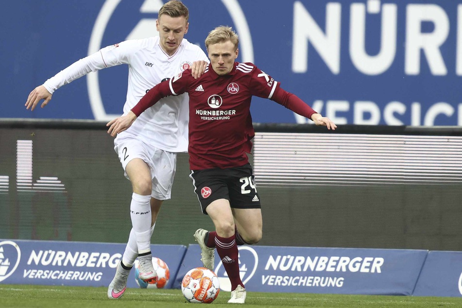 Der FC St. Pauli, hier Sebastian Ohlsson, hatte große Probleme mit der Geschwindigkeit von Nürnbergs Mats Möller-Daehli.