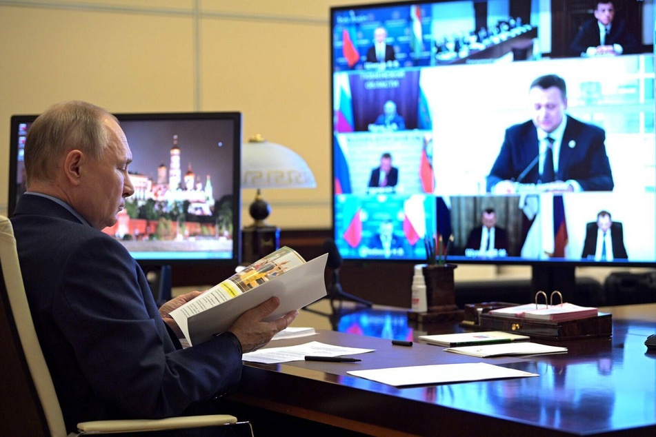 Russian President Vladimir Putin holds a joint video conference with government agencies.