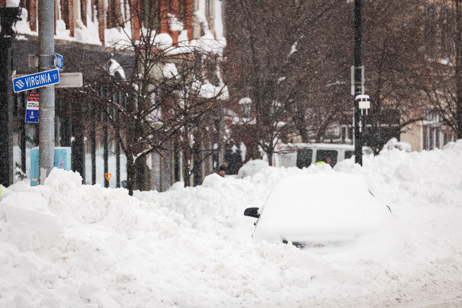 Buffalo has been hit particularly bad by winter storm Elliott, with several feet of snow covering streets and cars.