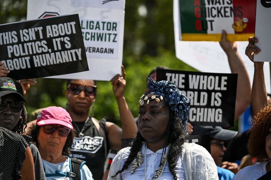 Protesters gather to demand the closure of the immigrant detention center known as "Alligator Alcatraz."