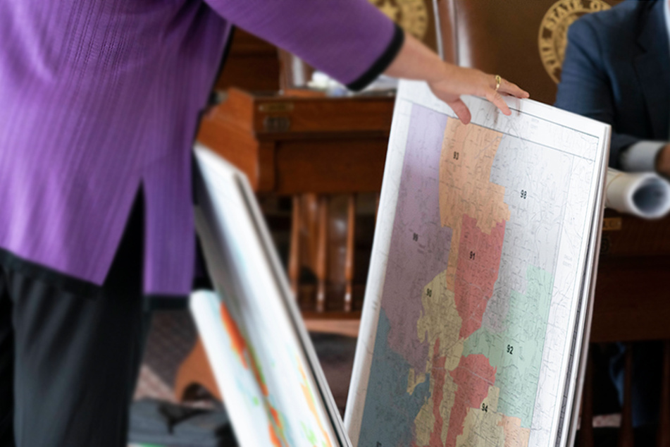 State Rep. Julie Johnson looks through redistricting maps during the second-called 87th Legislature special session on October 12 in Austin, Texas.