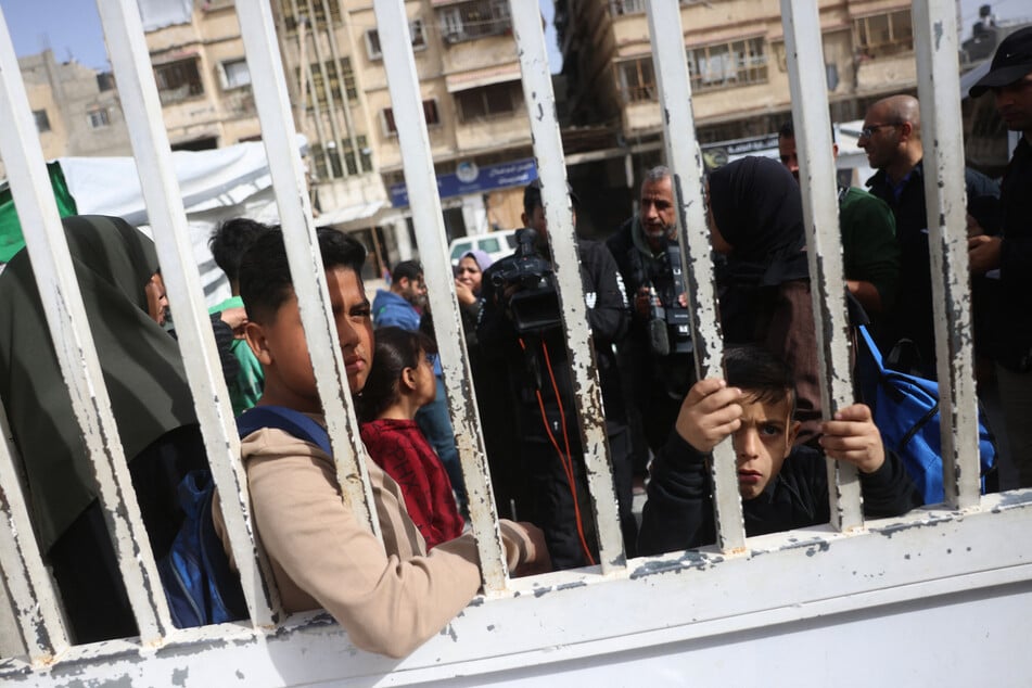 Palestinian youth and their guardians wait in the grounds of the Red Crescent Hospital to be evacuated from the Gaza Strip via the Rafah border crossing with Egypt on February 2, 2026.