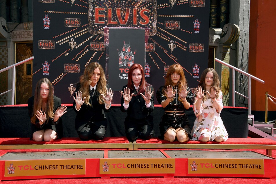 Lisa Marie Presley (second from l.) and her daughters, (from l to r) Harper, Riley, and Finley, along with Priscilla Presley (c.) show off their hand prints at the Handprint Ceremony at the TCL Chinese Theatre.