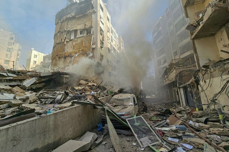 Lebanese firefighters put out a fire at the site of an Israeli airstrike that targeted Beirut’s southern suburbs neighborhood of Haret Hreik on November 17, 2024.