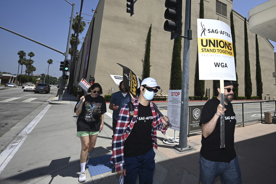 Actors' union agrees to last-minute deal, but Hollywood "double strike" still looms