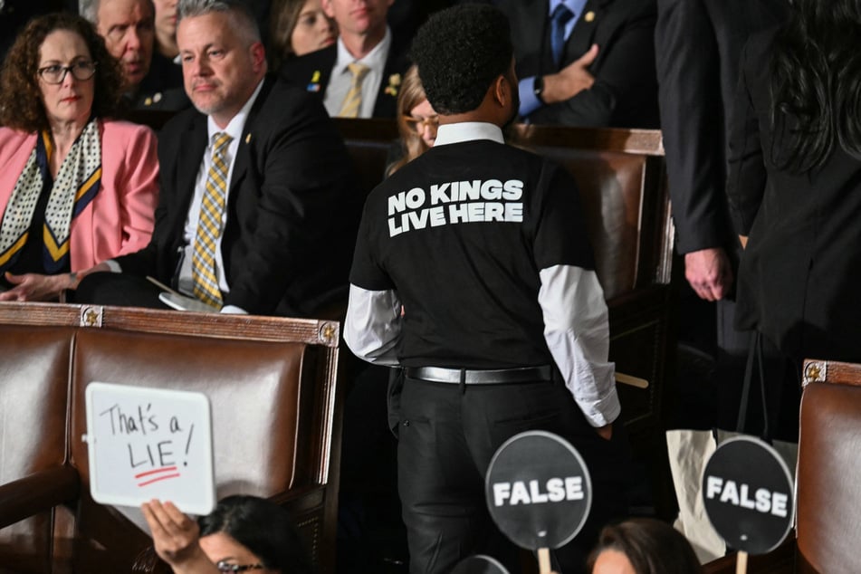 Some Democrats silently held up placards reading "False" and "That's a lie!" during Trump's address on Tuesday.