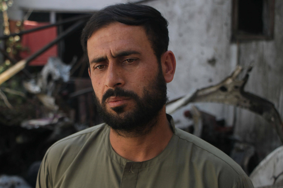 Emal Hamedi, a survivor of the drone strike, at the site of the attack in Kabul.