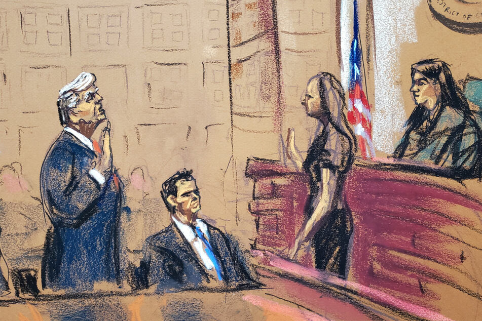 In a courtroom sketch of his arraignment on Thursday, former President Donald Trump stands next to his attorney John Lauro as he takes an oath.