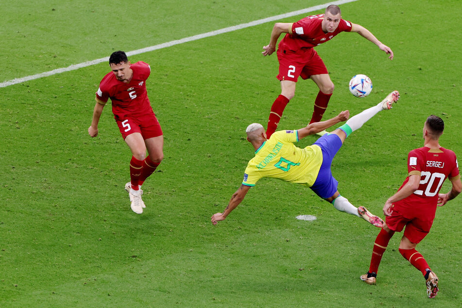 Richarlison (2nd from r.) in mid-overhead kick during Brazil's 2-0 win over Serbia.