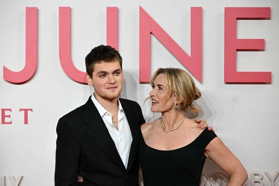 Joe Anders (l.) poses with his mother, Kate Winslet, on the red carpet upon arrival to attend the world premiere of the film Goodbye June in central London on December 3, 2025.