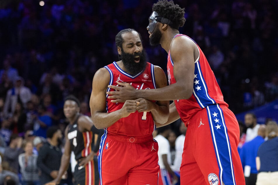 James Harden (l.) and Joel Embiid hug as the Sixers tie up their series with the Heat.