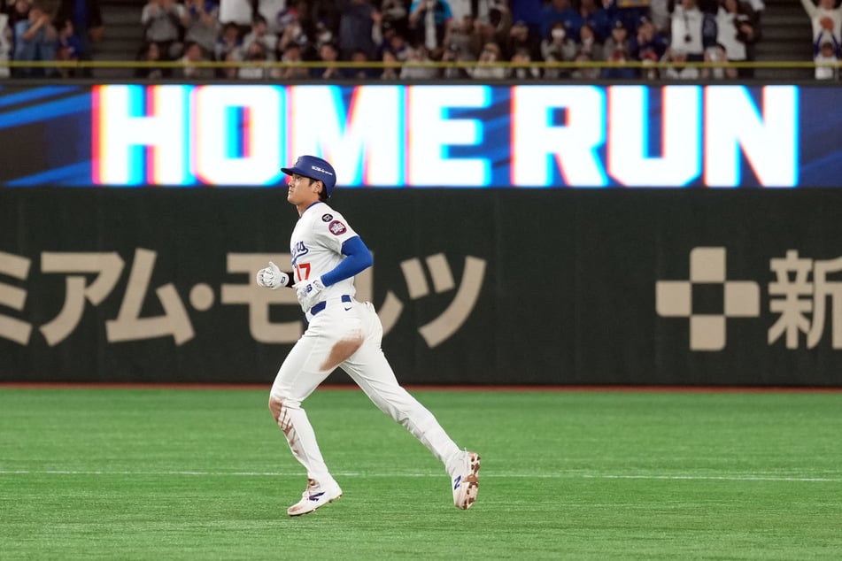 Los Angeles Dodgers designated hitter Shohei Ohtani rounds the bases after hitting a home run against the Yomiuri Giants during the third inning at Tokyo Dome in Japan.