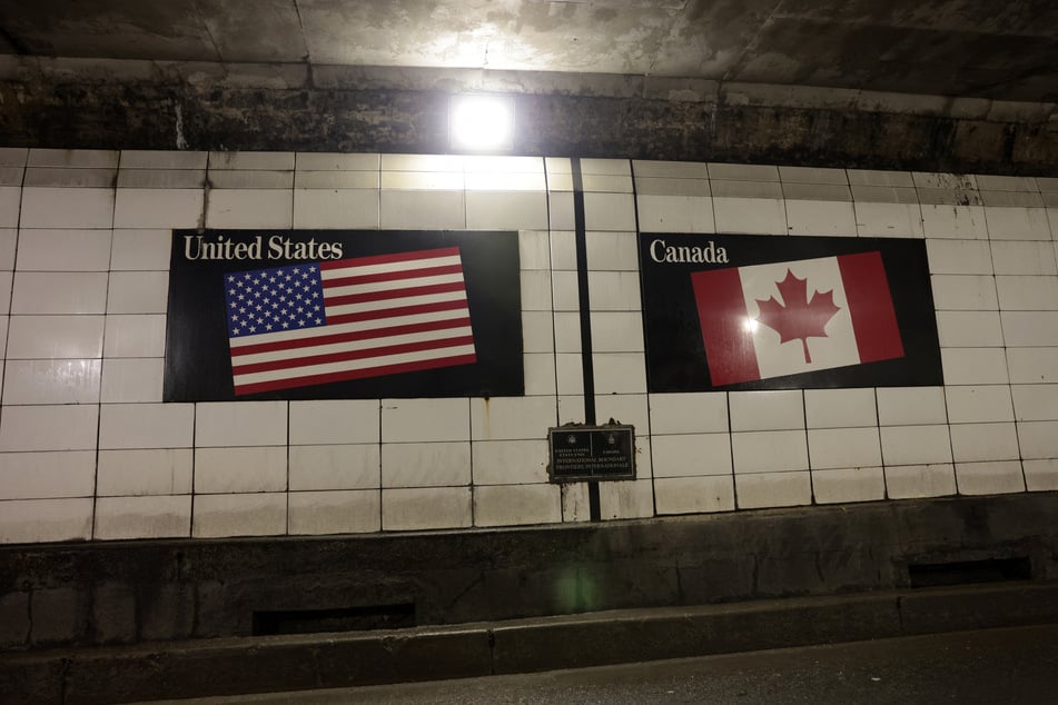 The border between USA and Canada is pictured inside the tunnel that connects Detroit, Michigan, to Windsor, Ontario.