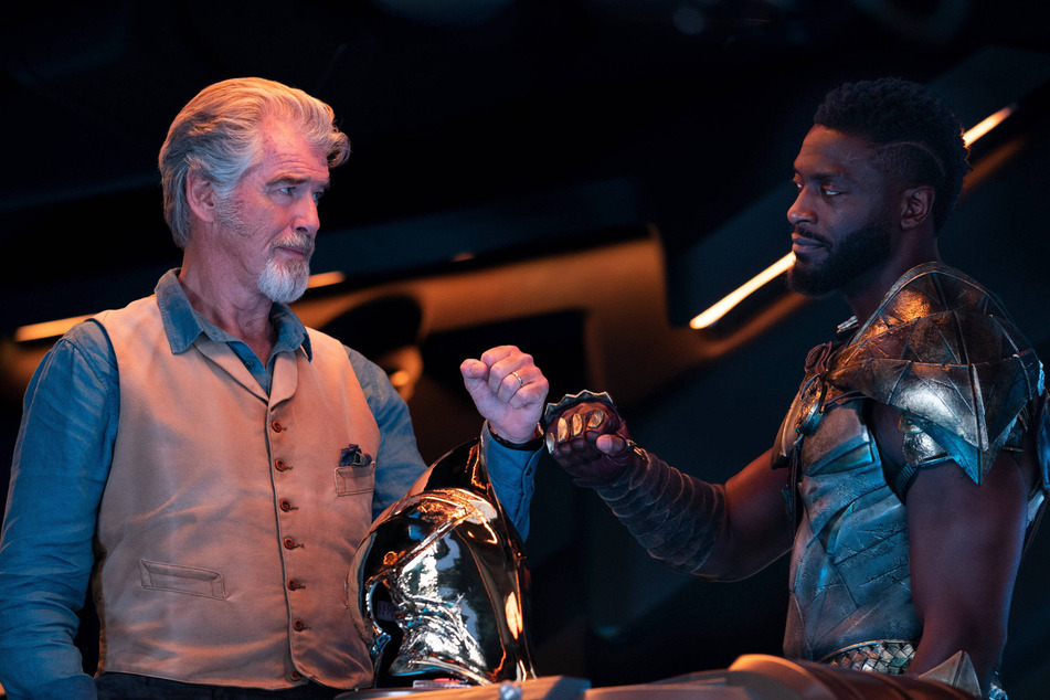 Pierce Brosnan (l) and Aldis Hodge steal the show as Justice Society of America (JSA) members Kent Nelson/Dr. Fate and as Carter Hall/Hawkman.