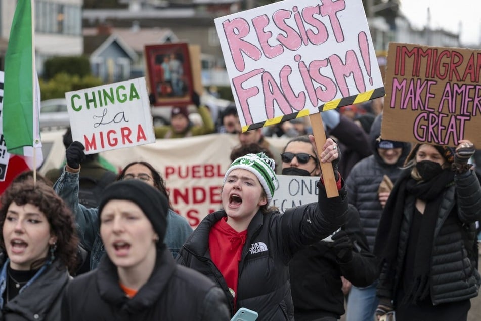 People march against US Immigration and Customs Enforcement in a rally entitled "Get our Gente Out of Guantanamo Bay!" in Seattle, Washington, on February 8, 2025.