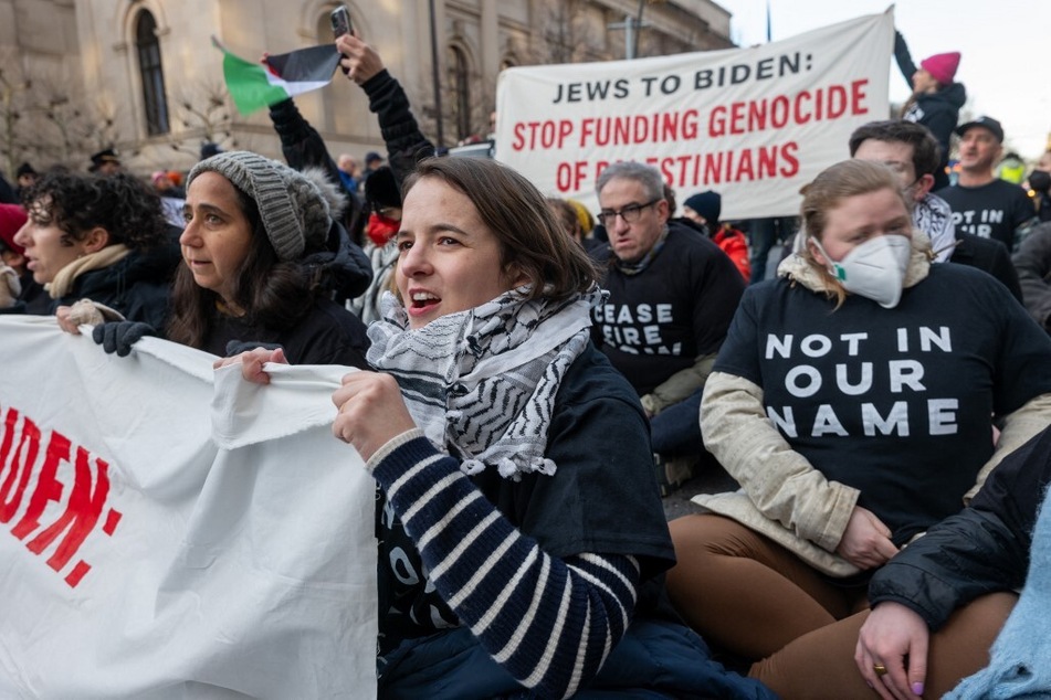 Jewish Voice for Peace members and others in New York City protest President Joe Biden's continued support for Israel's assault on Gaza.