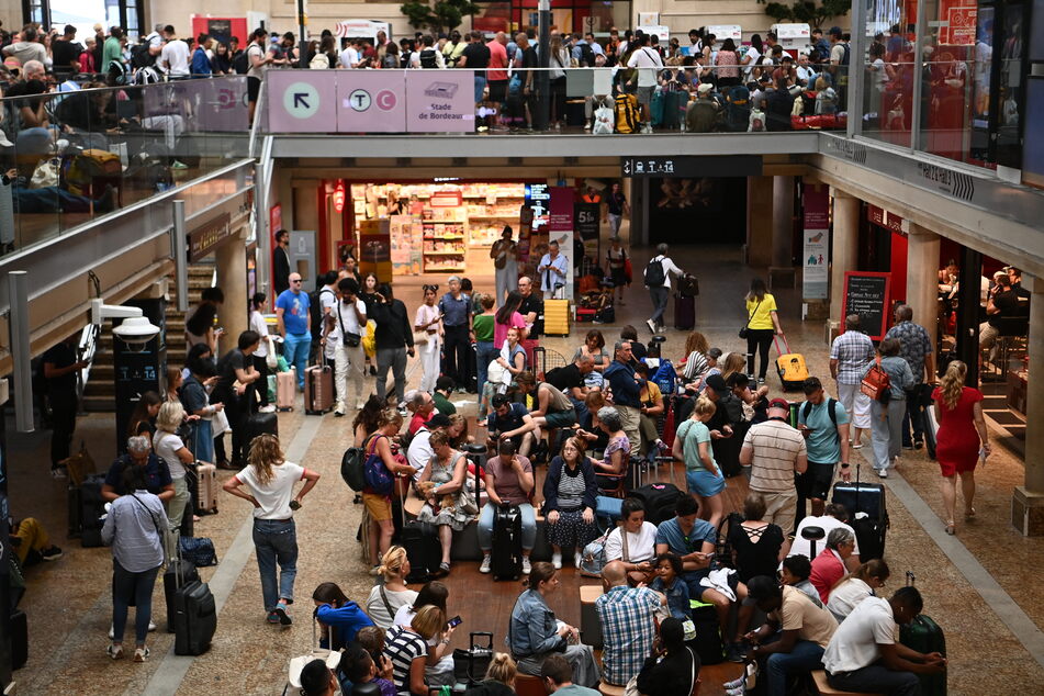 Passengers wait for their train departures at the Bordeaux-Saint-Jean train station in Bordeaux, western France on Friday.