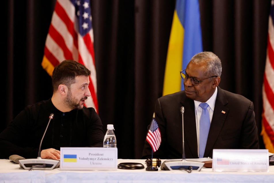 Ukraine's President Volodymyr Zelensky (l.) and US Defense Secretary Lloyd Austin speak during a press conference at the Ukraine Defense Contact Group meeting at Ramstein Air Base, Germany, on January 9, 2025.