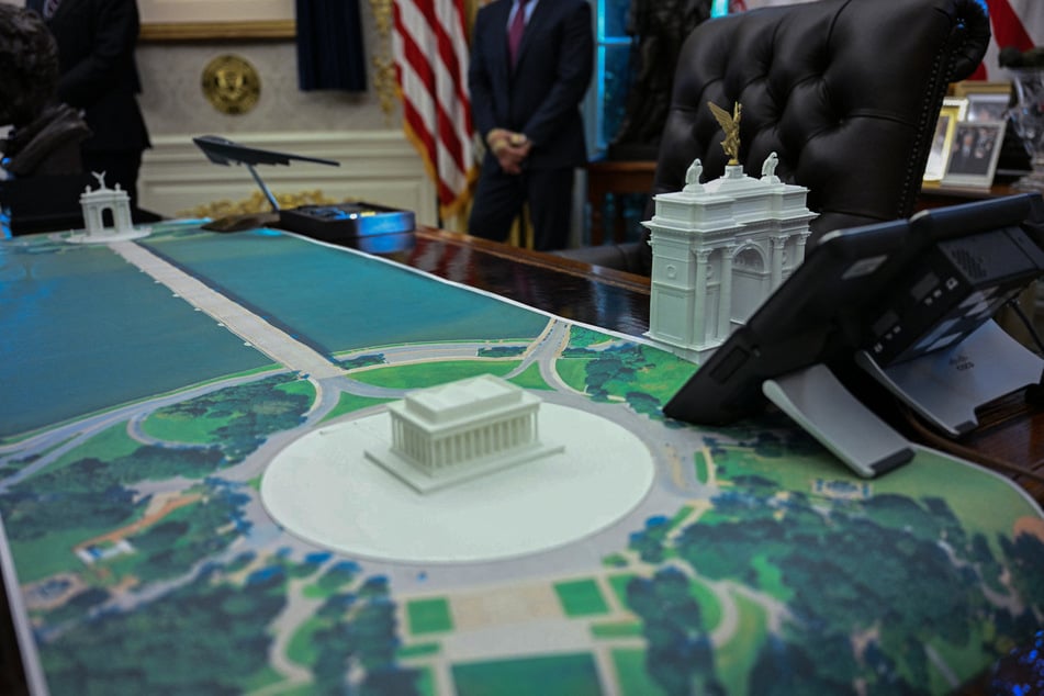 A plan for an arch across from the Lincoln Memorial is seen on the Resolute Desk of the Oval Office as President Donald Trump meets with Finnish President Alexander Stubb and Prime Minister Petteri Orpo on October 9, 2025.