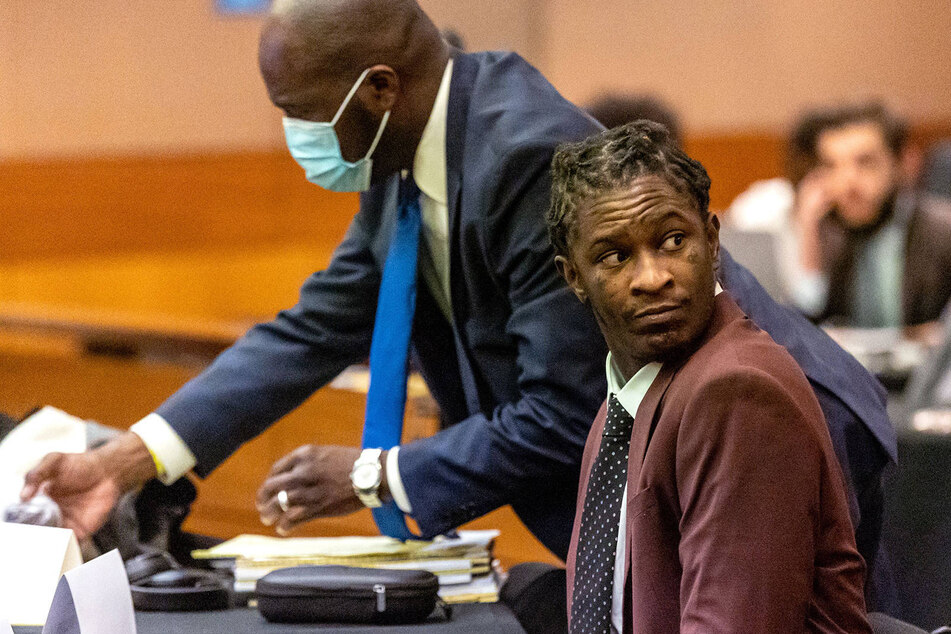 Atlanta rapper Young Thug, whose real name is Jeffery Williams, waits for the jury selection portion of his racketeering trial to continue in a Fulton County courtroom.