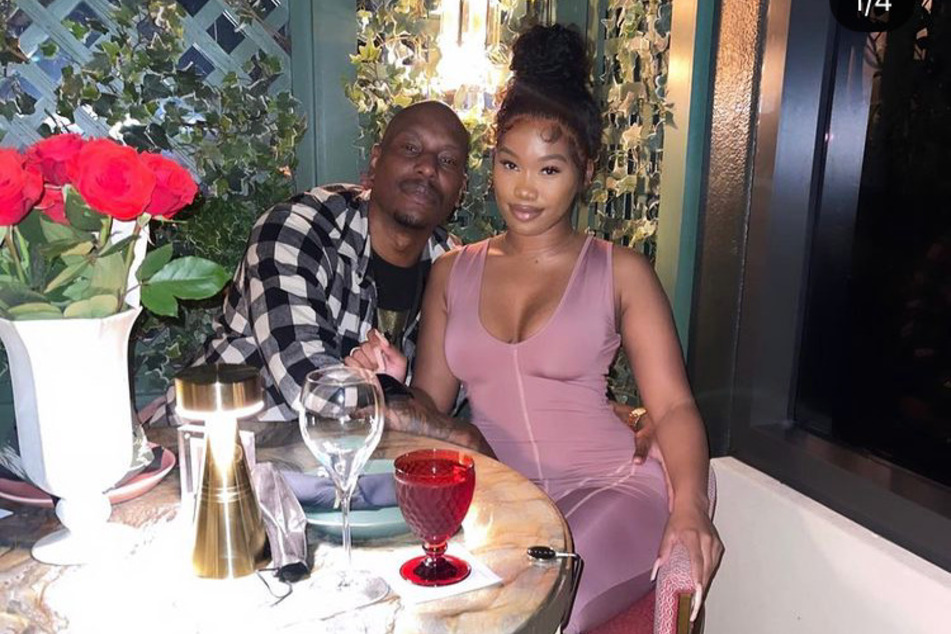 Tyrese and Zelie Timothy pose while having dinner together. The couple recently confirmed their relationship.