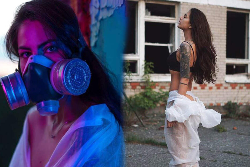 Veronika Rocheva (23) mit Gasmaske und leicht bekleidet vor einer wahren Geisterstadt-kulisse.