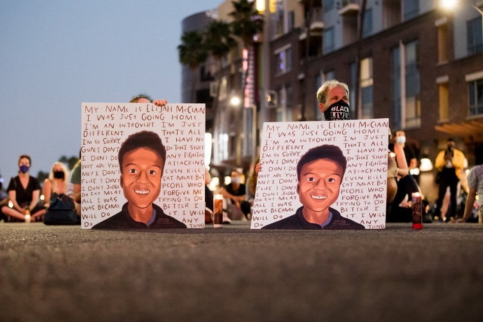 People in Los Angeles, California, gather at a candlelight vigil to demand justice for Elijah McClain on the one year anniversary of his death.