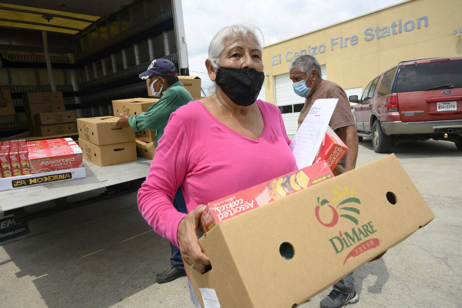 El Cenizo, Texas: Local volunteers distribute dozens of food boxes to the colonia of El Cenizo along the Texas-Mexico border.