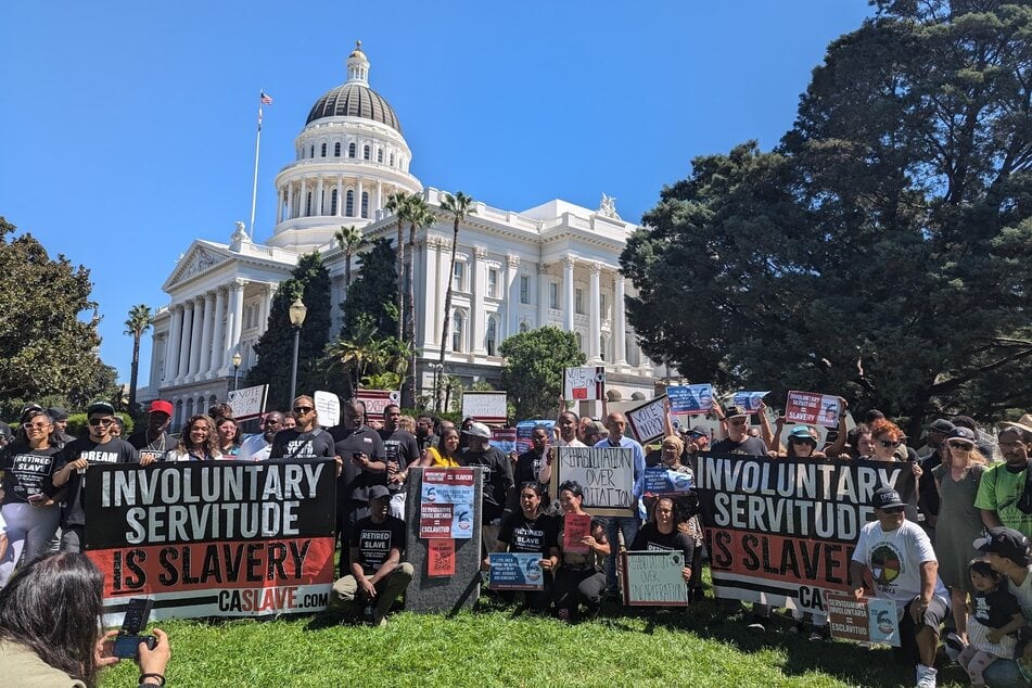 Supporters of California's Prop 6 rally for an end to involuntary servitude outside the State Capitol in Sacramento.