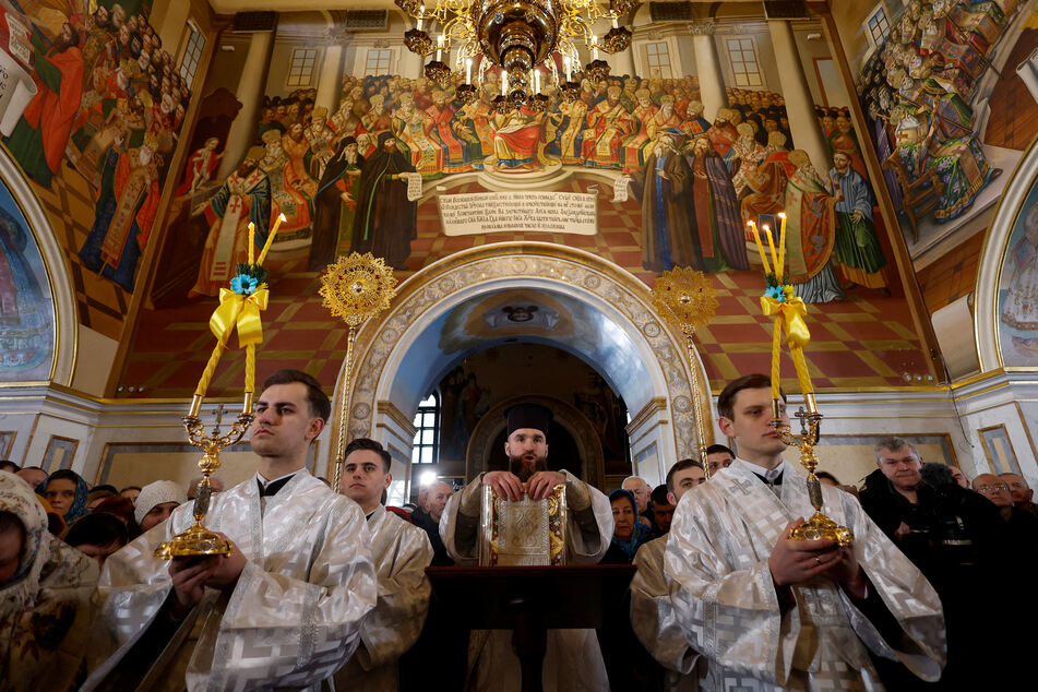 Priests of the Orthodox Church of Ukraine conduct a Christmas service inside Uspenskyi (Holy Dormition) Cathedral, at the compound of the Kyiv Pechersk Lavra monastery.