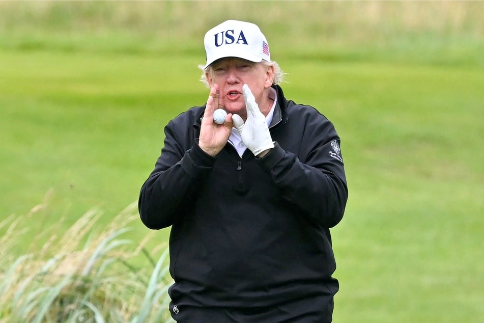 Social media users have been speculating whether a viral video of Donald Trump shows the US president cheating at a game of golf while in Scotland.
