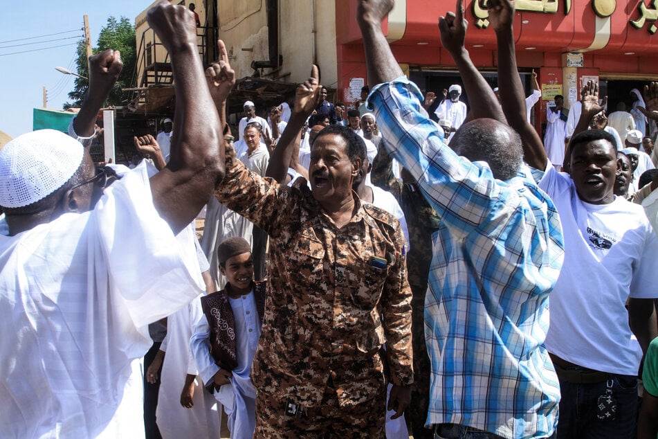 Local residents take part in a demonstration in Omdurman on October 31, 2025, to protest against the Rapid Support Forces’ reported atrocities in El-Fasher in western Sudan.