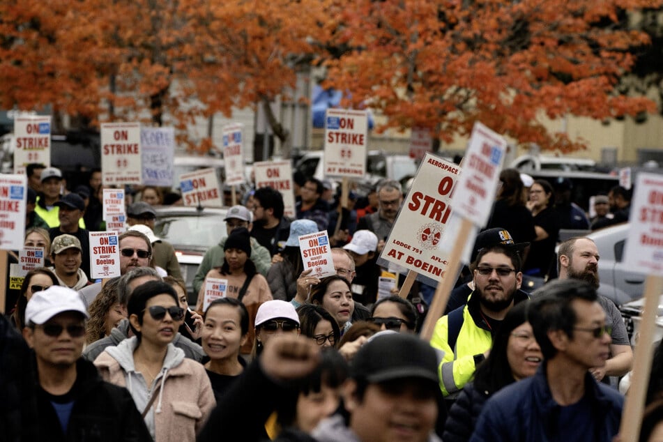 Boeing workers from the International Association of Machinists and Aerospace Workers District 751 hold a march during their strike in Seattle, Washington.