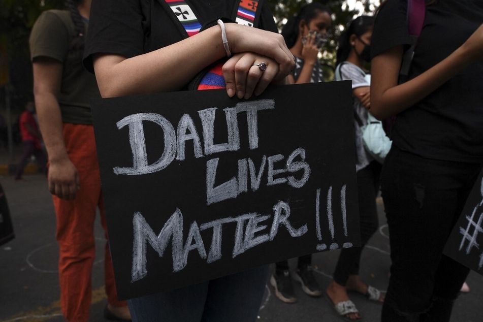 A demonstrator holds a sign reading "Dalit Lives Matter" during a protest in New Delhi, India.