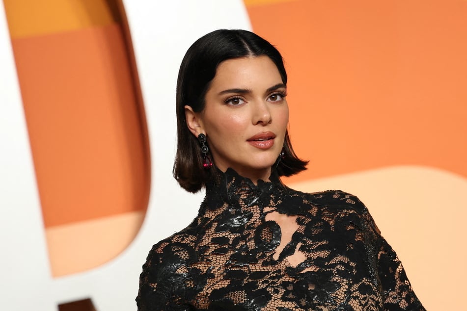 Kendall Jenner stunned in a black lace Mugler dress at the Vanity Fair Oscars Party.