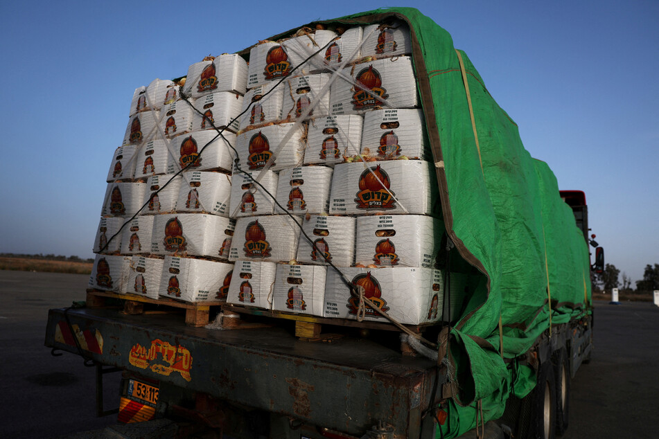 A Gaza-bound food aid truck sits abandoned near the entrance to the Kerem Shalom border crossing.