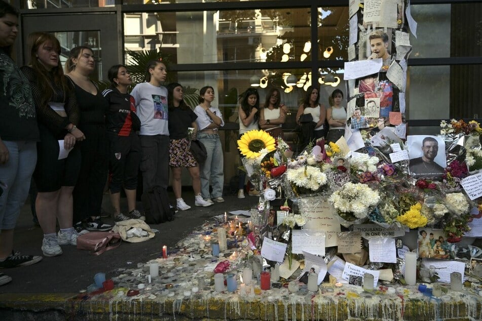 Fans pay tribute to Liam Payne in front of the hotel where he died in Buenos Aires, Argentina.