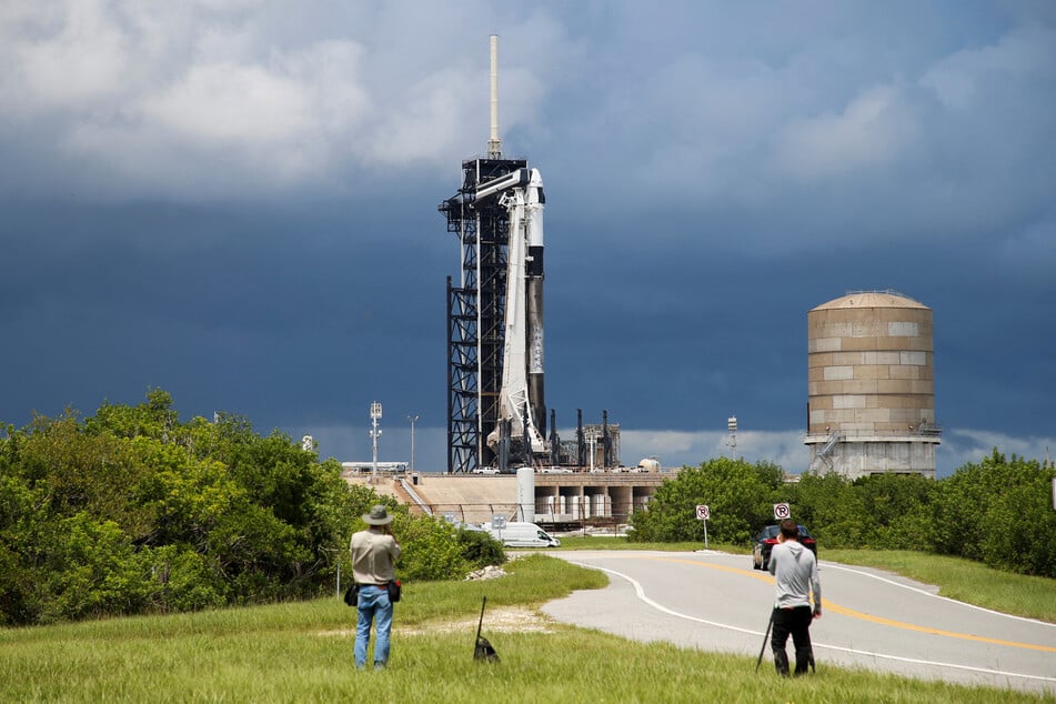 SpaceX was forced to postpone the launch of a mission aiming at a first-ever all-civilian spacewalk due to "unfavorable" weather conditions.