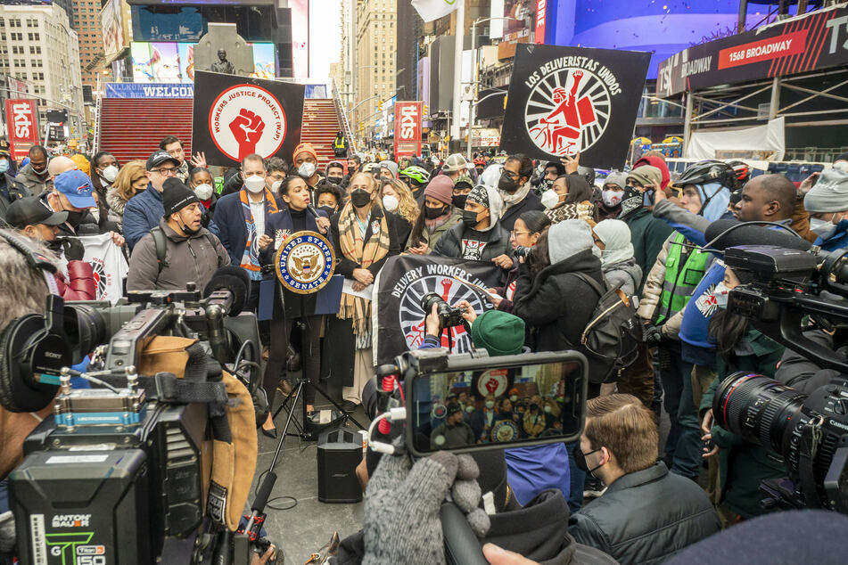 Rep. Alexandria Ocasio-Cortez spoke at a rally for New York delivery workers in Times Square on Sunday.