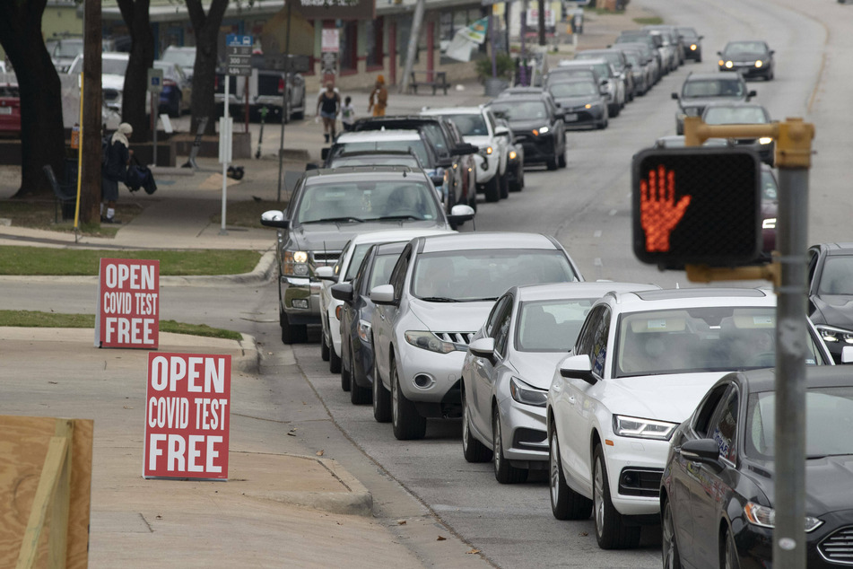 A long line of cars wait for a free Covid-19 test at a test site in Austin, Texas amid a surge in cases.