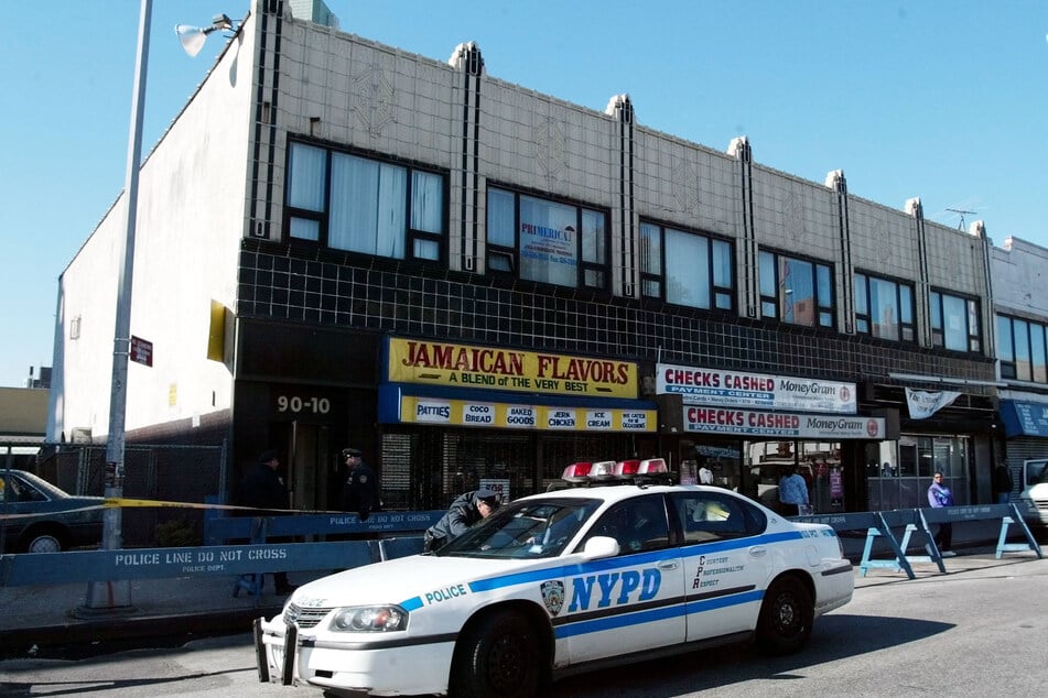 A New York City Police car sits in the street outside a music studio in Queens, New York, on October 31, 2002, where former Run DMC member Jason Mizell, who was also known as DJ Jam Master Jay, was shot and killed the day before.