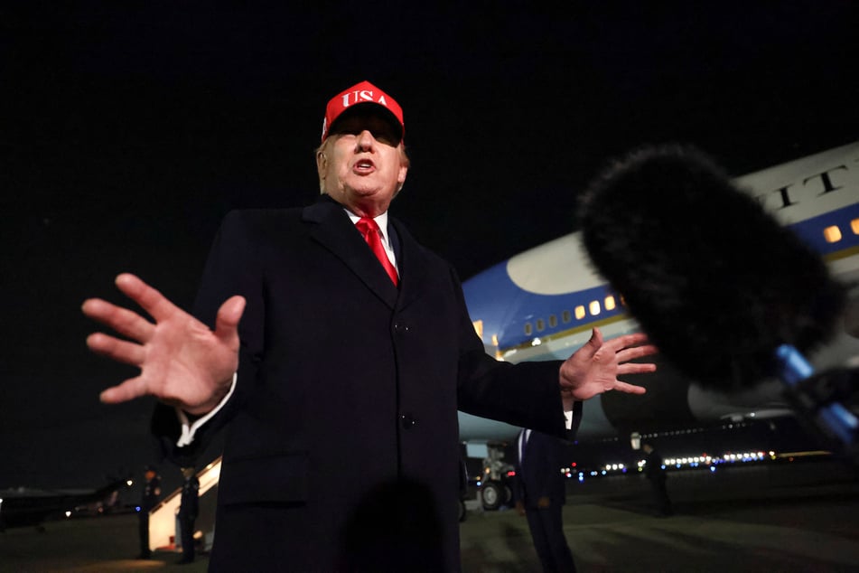 President Donald Trump speaks to reporters after disembarking Air Force One at Joint Base Andrews in Maryland on April 12, 2026.