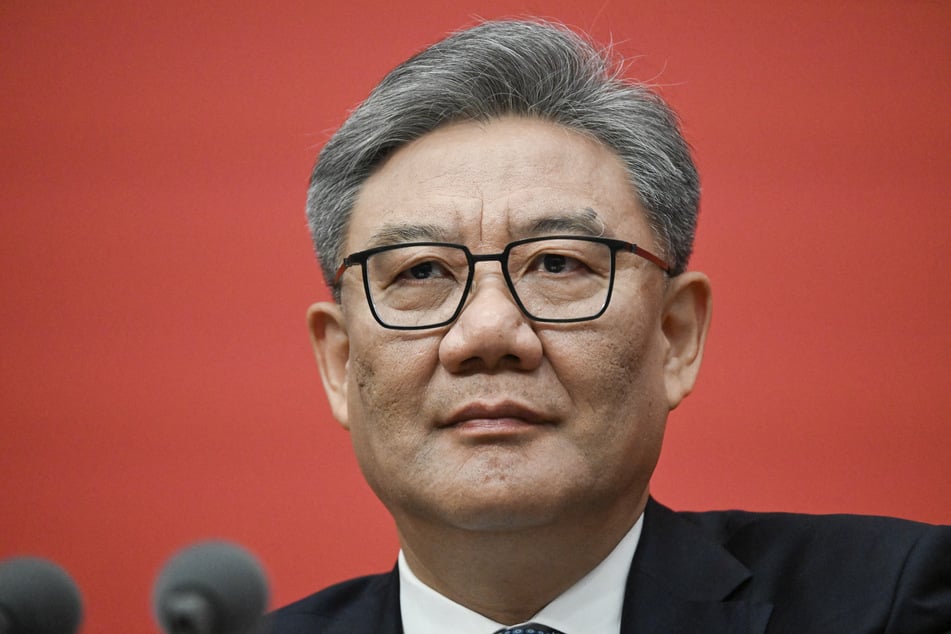 China’s Minister of Commerce Wang Wentao attends a press conference of the Central Committee of the Communist Party of China in Beijing on October 24, 2025.